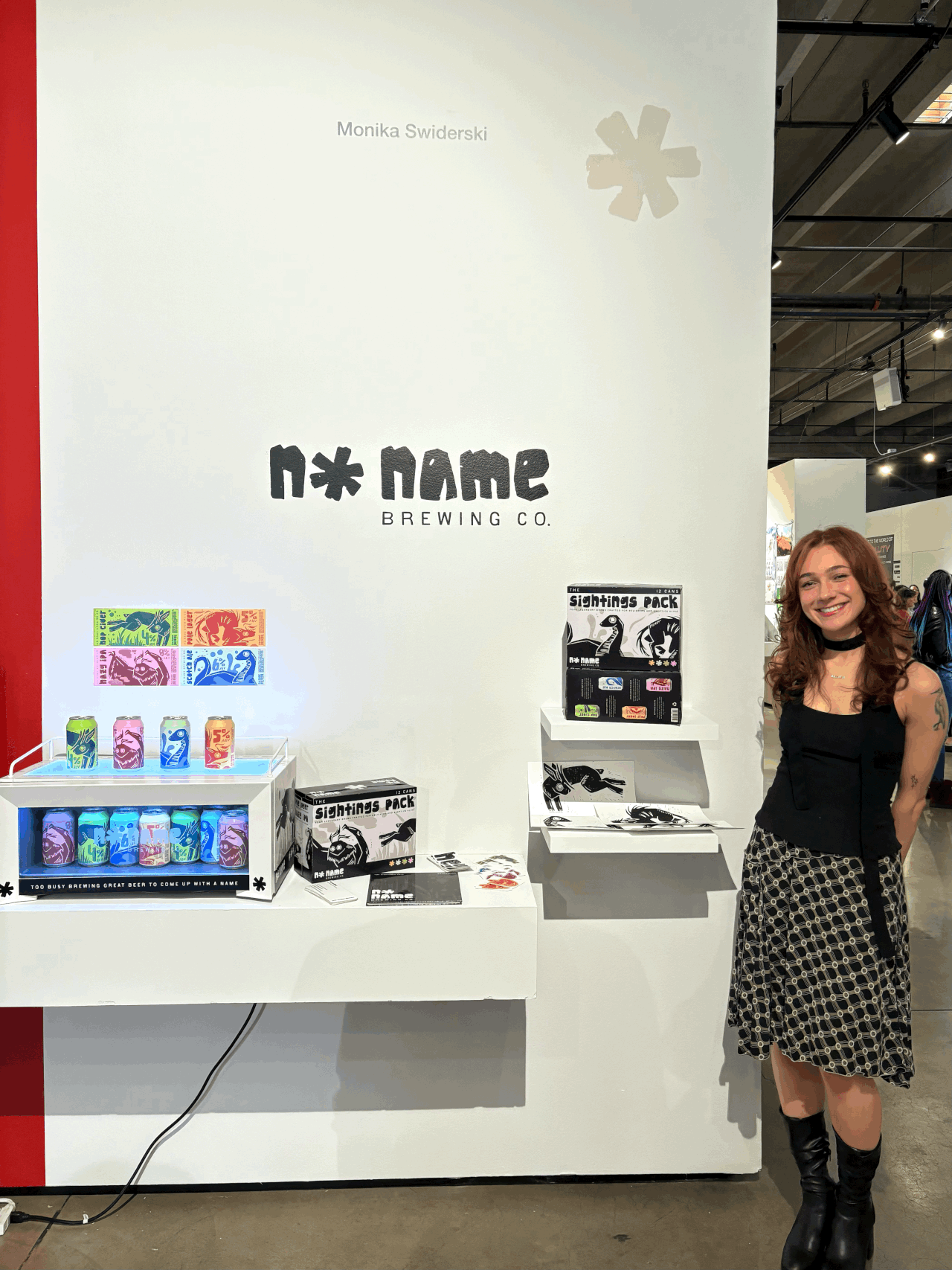 Graphic of a typography specimen showing the alphabet and numerals on top of a dark gray background.